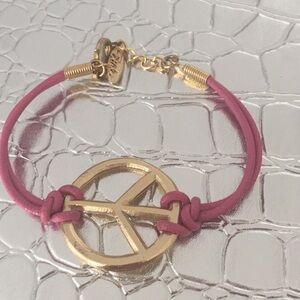 Ettika peace sign bracelet.